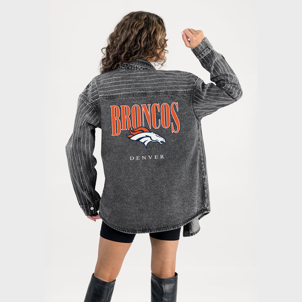 Back of Gameday Couture’s washed black denim overshirt with Broncos graphics and rhinestone stripes.